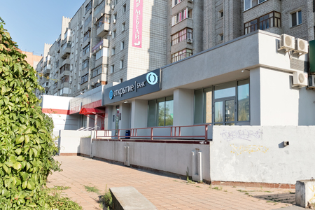 VOLGOGRAD - SEPTEMBER 9: Bank branch OTKRITIE located on the first floor of a multystoried house. September 29 2017 in Volgograd Russia.のeditorial素材