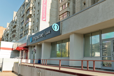 VOLGOGRAD - SEPTEMBER 9: Bank branch OTKRITIE located on the first floor of a multystoried house. September 29 2017 in Volgograd Russia.のeditorial素材