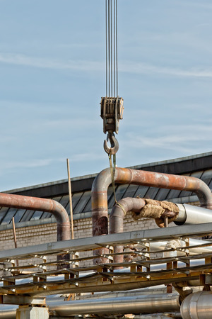 Works on installation of pipelines in oil refinery plant with auto crane heavy-dutyの写真素材
