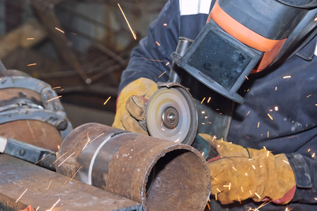 Welder in the mask processes, the weld seam grinding machineの写真素材