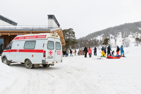 KARACHAY-CHERKESSIA, ARKHYZ- JANUARY 21: The ambulance staff provided first aid to the injured skier at a ski resort. January 21, 2018 in Arkhyz, Russia.のeditorial素材