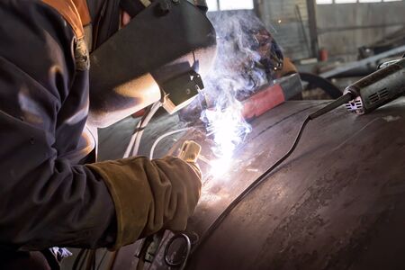 Manufacture of large diameter heat exchanger shell in the shop using manual arc weldingの写真素材