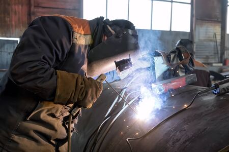 Manufacture of large diameter heat exchanger shell in the shop using manual arc weldingの写真素材