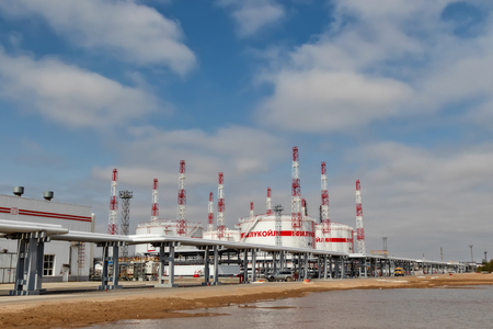 VOLGOGRAD - APRIL 12: The new tank farm with lightning arresters and piping system mounted on the old oil refinery LUKOIL. April 12, 2018 in Volgograd, Russia.のeditorial素材