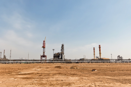 View of the old oil refinery plant installation with gantry crane for repair workの写真素材