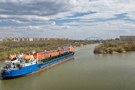 VOLGOGRAD, RUSSIA - APRIL 29: Large river barges for transportation of oil products swim through the navigable Volga-don canal. April 29, 2018  in Volgograd, Russia.のeditorial素材