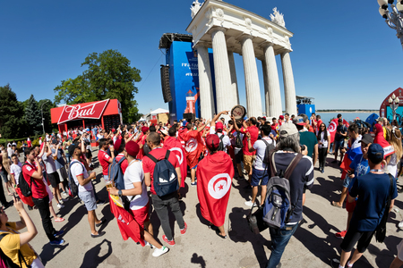 VOLGOGRAD - JUNE 18: TFootball fans of the national team of Tunisia with national flags and attributes in fanzone fanfesta before the match England-Tunisia. June 18, 2016 in Volgograd, Russia.のeditorial素材