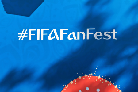 VOLGOGRAD - JUNE 18: FThe hashtag fifafanfest is written on a banner with the symbols of the world Cup Russia 2018 in fanzone. June 18, 2018 in Volgograd, Russia.のeditorial素材
