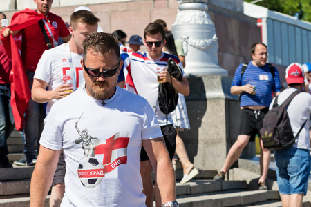 VOLGOGRAD - JUNE 18: Football fans of the national team of England with national flags and attributes in fanzone fanfesta before the match England-England. June 18, 2018 in Volgograd, Russia.のeditorial素材