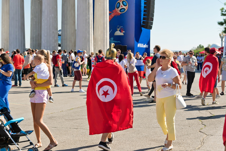 VOLGOGRAD - JUNE 18: Football fans of the national team of Tunisia with national flags and attributes in fanzone fanfesta before the match England-Tunisia. June 18, 2018 in Volgograd, Russia.のeditorial素材