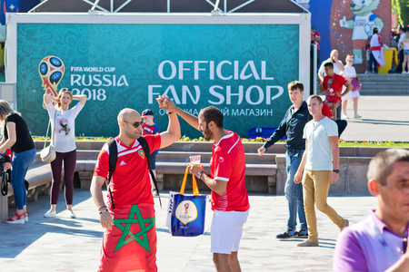 VOLGOGRAD - JUNE 18: Football fans of the national team of Tunisia with national flags and attributes in fanzone fanfesta before the match England-Tunisia. June 18, 2018 in Volgograd, Russia.のeditorial素材