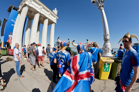 VOLGOGRAD - JUNE 22: Fans of team of Iceland dressed as Vikings and clothes in colors of national flag rest at festival of ballet dancers. June 22, 2016 in Volgograd, Russia.のeditorial素材