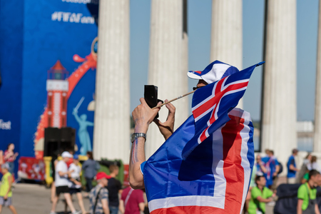 VOLGOGRAD - JUNE 22: Fans of team of Iceland dressed as Vikings and clothes in colors of national flag rest at festival of ballet dancers. June 22, 2016 in Volgograd, Russia.のeditorial素材