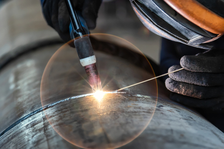 Assembly of pipeline assemblies in the Assembly shop using argon-arc welding. Welder, arc welding...