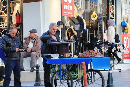 ANTALYA, TURKEY - NOVEMBER 16: Preparation of the local dealer in roasted chestnuts on the coals on the streets. November 16, 2018  in Antalya, Turkey.のeditorial素材