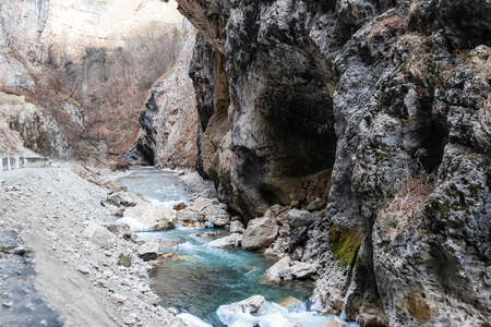 Wines of the slopes of the mountains and cliffs in a mountain gorge in winterの写真素材