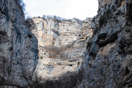 Wines of the slopes of the mountains and cliffs in a mountain gorge in winterの写真素材