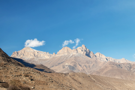 Mountain landscape with views of mountain ranges and passes with clouds in the skyの写真素材