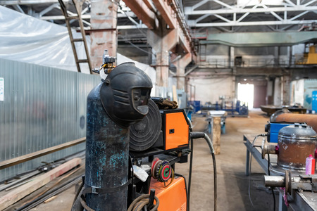 The device for semi-automatic welding in the environment of protective gases is in a spacious shop for the Assembly of metal structuresの写真素材