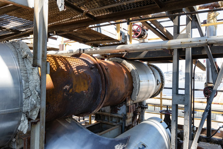 Replacement of thermal insulation on the old rusty heat exchangerの写真素材