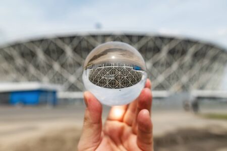VOLGOGRAD - MAY 4: The view of the stadium Volgograd arena from the Park through lensball. May 4, 2019 in Volgograd, Russia.のeditorial素材