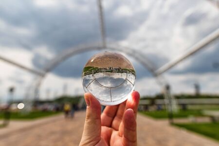 VOLGOGRAD - MAY 4: View of the Park at the foot of Mamayev Kurgan opposite the Volgograd arena stadium
 through lensball. May 4, 2019 in Volgograd, Russia.のeditorial素材