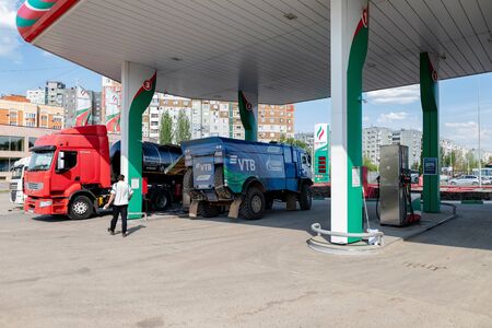 VOLGOGRAD - APRIL 28: Rally KAMAZ truck with the symbols of the sponsors is refilled at the filling stations of TATNEFT. April 28, 2019 in Volgograd, Russia.のeditorial素材