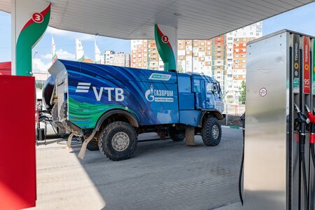 VOLGOGRAD - APRIL 28: Rally KAMAZ truck with the symbols of the sponsors is refilled at the filling stations of TATNEFT. April 28, 2019 in Volgograd, Russia.のeditorial素材