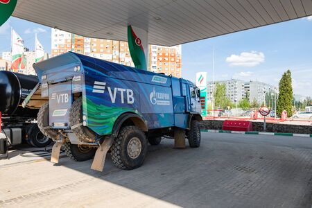 VOLGOGRAD - APRIL 28: Rally KAMAZ truck with the symbols of the sponsors is refilled at the filling stations of TATNEFT. April 28, 2019 in Volgograd, Russia.のeditorial素材