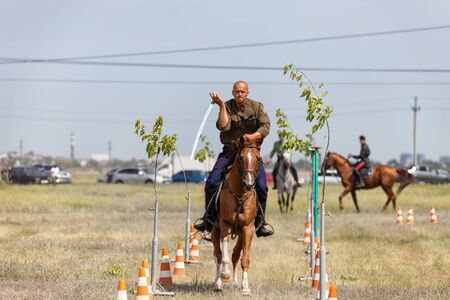 SMALL CHAPURNIKI, VOLGOGRAD, RUSSIA - JUNE 8: Demonstrations Cossack equestrian sports club with a demonstration of possession of a combat sword. June 8, 2019 in Volgograd, Russia.のeditorial素材