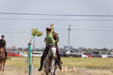 SMALL CHAPURNIKI, VOLGOGRAD, RUSSIA - JUNE 8: Demonstrations Cossack equestrian sports club with a demonstration of possession of a combat sword. June 8, 2019 in Volgograd, Russia.のeditorial素材