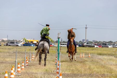 SMALL CHAPURNIKI, VOLGOGRAD, RUSSIA - JUNE 8: Demonstrations Cossack equestrian sports club with a demonstration of possession of a combat sword. June 8, 2019 in Volgograd, Russia.のeditorial素材