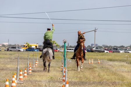 SMALL CHAPURNIKI, VOLGOGRAD, RUSSIA - JUNE 8: Demonstrations Cossack equestrian sports club with a demonstration of possession of a combat sword. June 8, 2019 in Volgograd, Russia.のeditorial素材
