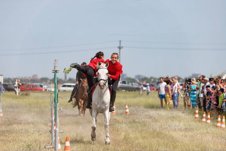 SMALL CHAPURNIKI, VOLGOGRAD, RUSSIA - JUNE 8: Demonstrations Cossack equestrian sports club with acrobatic elements and tricks. June 8, 2019 in Volgograd, Russia.のeditorial素材
