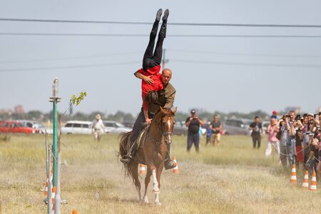 SMALL CHAPURNIKI, VOLGOGRAD, RUSSIA - JUNE 8: Demonstrations Cossack equestrian sports club with acrobatic elements and tricks. June 8, 2019 in Volgograd, Russia.のeditorial素材