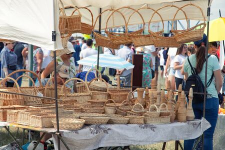 VOLGOGRAD, RUSSIA - JUNE 8: Sale of hand-woven baskets and bags at Sabantuy celebration. June 8, 2019 in Volgograd, Russia.のeditorial素材