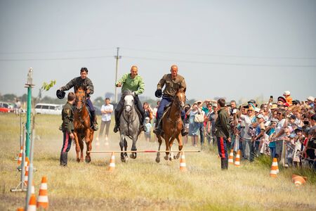 VOLGOGRAD, RUSSIA - JUNE 8: Demonstration of Cossacks ability of representatives to stay in saddle and perform tricks on horseback. June 8, 2019 in Volgograd, Russia.のeditorial素材