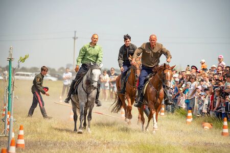 VOLGOGRAD, RUSSIA - JUNE 8: Demonstration of Cossacks ability of representatives to stay in saddle and perform tricks on horseback. June 8, 2019 in Volgograd, Russia.のeditorial素材