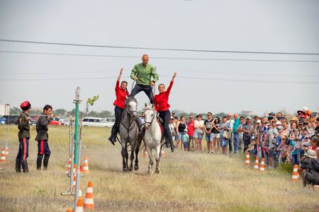 VOLGOGRAD, RUSSIA - JUNE 8: Demonstration of Cossacks ability of representatives to stay in saddle and perform tricks on horseback. June 8, 2019 in Volgograd, Russia.のeditorial素材