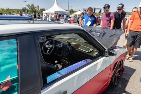 VOLGOGRAD, RUSSIA - JULY 7: View inside the car tuning with a sports steering wheel and a special keyboard. July 7, 2019 in Volgograd, Russia.のeditorial素材