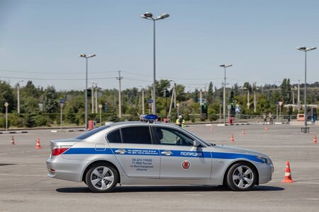 VOLGOGRAD, RUSSIA - JULY 7: Police traffic officers are involved in the time attack race in BMW patrol cars. July 7, 2019 in Volgograd, Russia.のeditorial素材