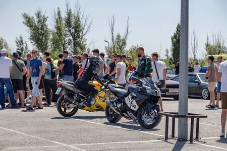 VOLGOGRAD, RUSSIA - JULY 7: Biker girl with her yellow sports motorcycle at motorcycle show. July 7, 2019 in Volgograd, Russia.のeditorial素材