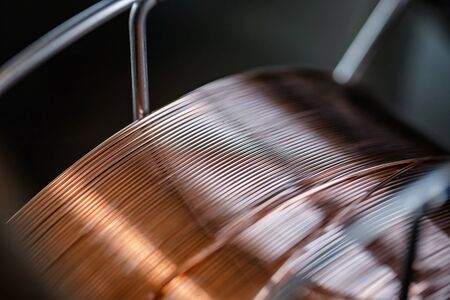 Working atmosphere in an old welding shop with a focus on the coil of welding wire for automatic welding in shielding gasesの写真素材