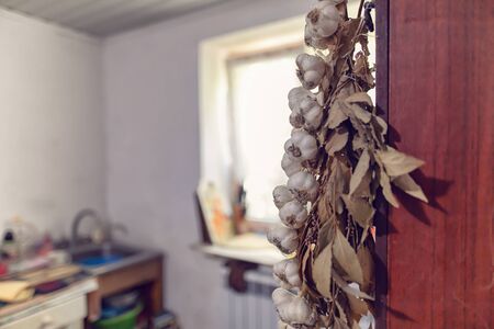 In the kitchen in the village house there is always a bundle of garlic and Bay leafの写真素材