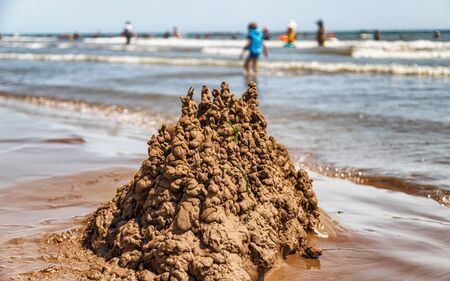 Sand castle built by children on the shore of the resort beach Caspian seaの写真素材