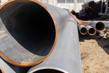 Steel pipe rolled products painted with gray ground paint in the warehouse of metal productsの写真素材