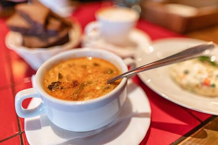 Traditional in Russian cuisine soup rassolnik served in the restaurant in a soup plateの写真素材