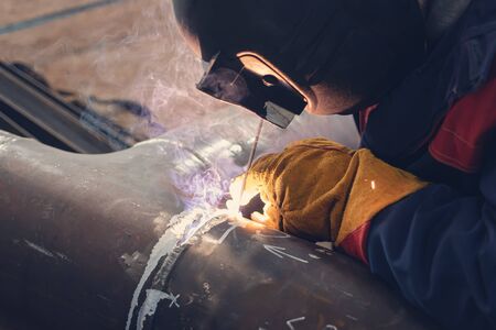 Welding work on the Assembly of components of the steel pipe by manual arc welding with coated...
