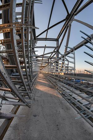 Construction of a new cable overpass made of aluminum profile with a concrete baseの写真素材