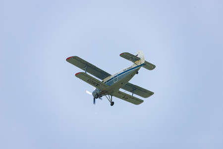 ESSENTUKI- JUNE 07: Light-engine propeller aircraft AN-2 flying in the sky. View from the ground . June 07, 2020 in Essentuki, Russia.のeditorial素材